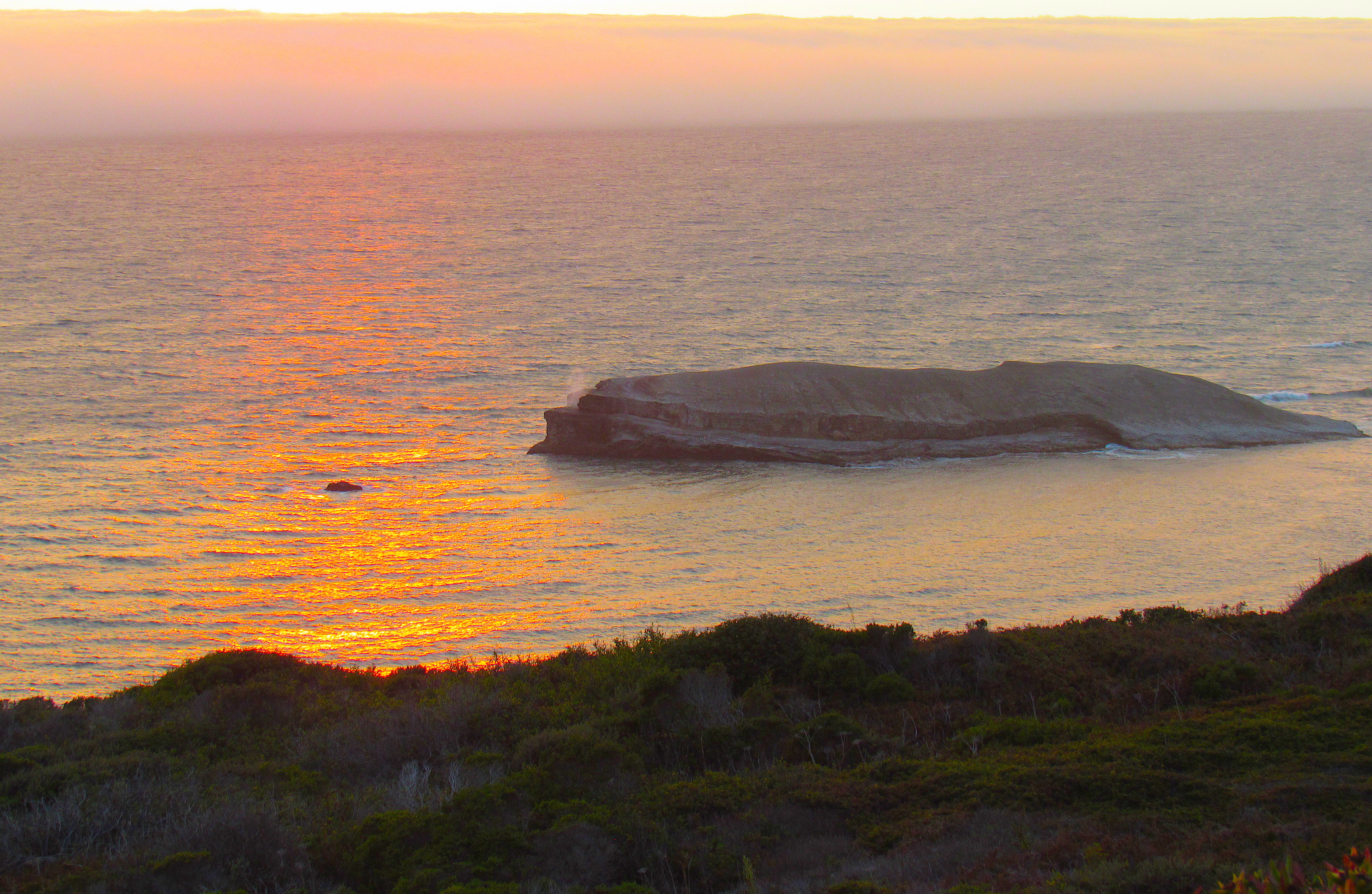 Random island, photoed on a sunset. Spot the ghost!